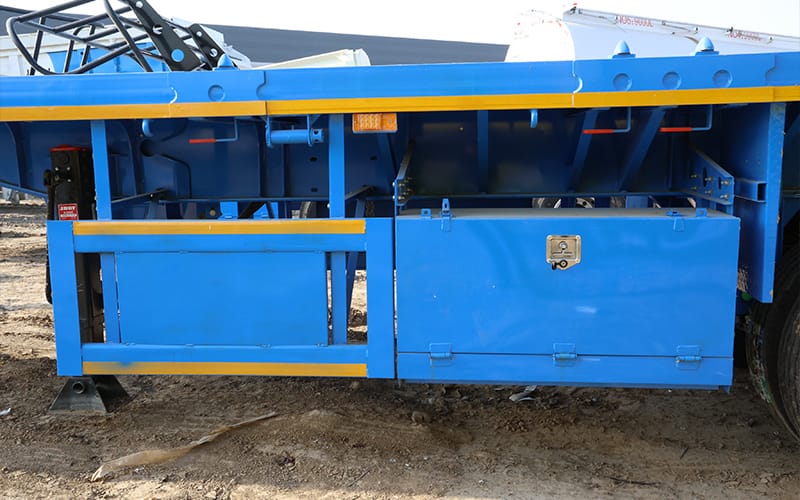 Flatbed trailer side storage and guard arrangement